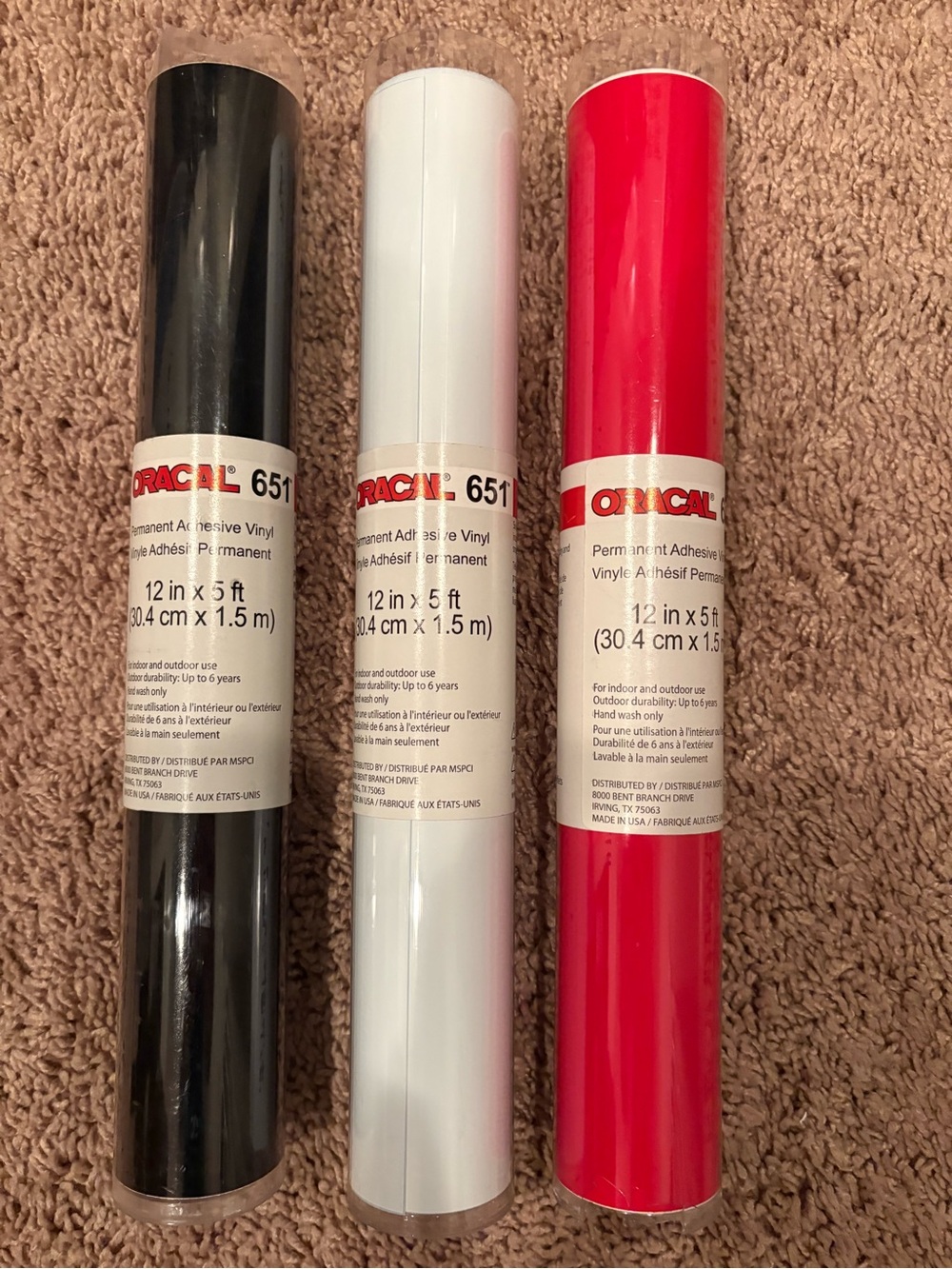 Oracal 651 Permanent Adhesive Vinyl Rolls - White, black, and red